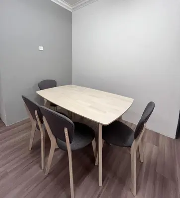 a wooden table and chairs in a room at Cameron Emerald Avenue 2 @ Brinchang in Brinchang