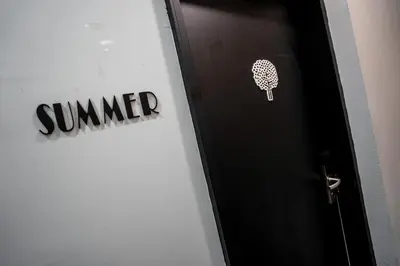 a door with a sign that says summer on it at Chulia Heritage Studio in George Town