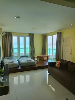 a living room with two beds and a couch at Mansion One Peaceful Homestay in George Town