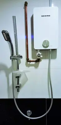 a water hose hooked up to a sink at Mansion One Peaceful Homestay in George Town