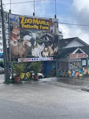 a building with a large sign with animals on it at EquatorialHillResort SunsetView 10Min Popular FARM in Brinchang