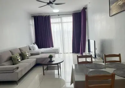 a living room with a couch and a table at Beacon Executive Suites by Simply Penang in George Town