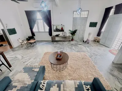 a living room with a couch and a table at Entire Residential House Alma Bukit Mertajam Spacious 4 bedroom in Bukit Mertajam