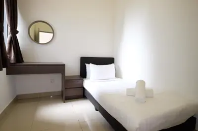 a bedroom with two beds with a mirror and a mirror at PLAY at Palas Horizon @ Kea Farm in Cameron Highlands
