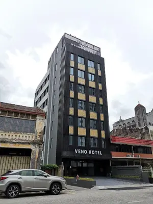 a car parked in front of a hotel at VENO HOTEL in George Town