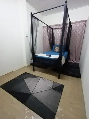 a room with a hammock in a room at Minimalist Shop Stay @ Royal Town in Kuala Kangsar