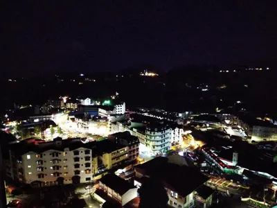 a view of a city at night with lights at Homstay Cameron Highlands in Cameron Highlands