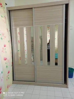 a sliding glass door in a room at Taiping Desa Jana Home Stay in Kamunting