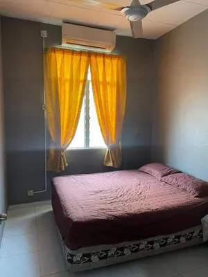 a bedroom with a bed and a window with curtains at Aqil Homestay Lunas Kulim for Mslim only in Lunas