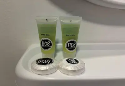 two bottles of cleaning products sitting on top of a toilet at 1108 Carebin Slim River in Slim River