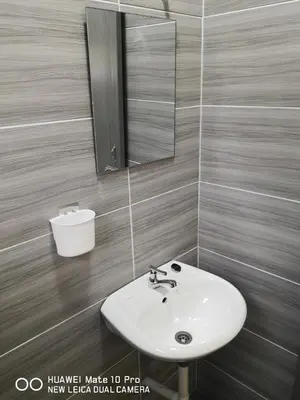 a bathroom with a sink and a mirror at TB HOMESTAY Tasek klebang(taman bertuah) 10pax wifi in Chemor