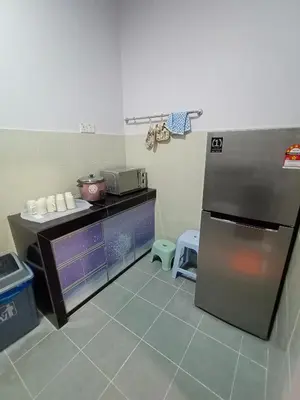 a kitchen with a stainless steel refrigerator and a counter at Cameron Emerald Avenue Clover @ Brinchang in Brinchang