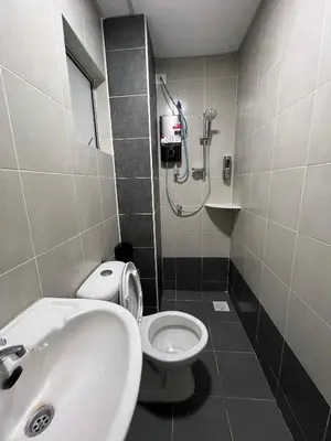 a bathroom with a toilet and a sink and a shower at Cameron Emerald Avenue Clover @ Brinchang in Brinchang