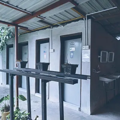 a building with a row of sinks and toilets at The Rustique Guest House in Tanah Rata