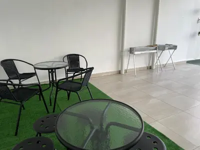 a room with a table and chairs and a piano at Paradise Penthouse 5 bedrooms 5 bathrooms in Tanah Rata