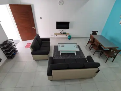 a living room with two couches and a coffee table at My Homestay N43 (14 pax) @ Golden Hills Night Market in Tanah Rata