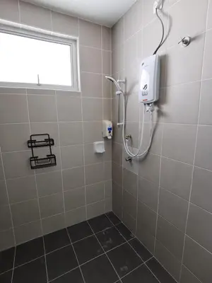 a shower stall in a bathroom with a window at My Homestay N43 (14 pax) @ Golden Hills Night Market in Tanah Rata
