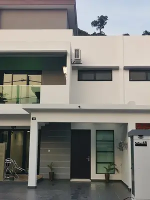 a white house with a black door at 48 \u60a0\u4e4b\u5904NO . 48, PERSIARAN ALAM IMPIAN 3 VILLA RIADAH ALAM IMPIAN PANGKOR, 32300 PANGKOR , PERAK. in Pangkor