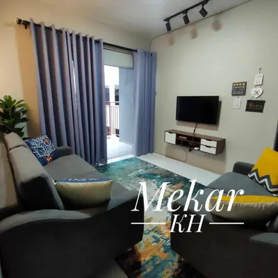 a living room with a couch and a television at Mekar KH Homestay (Muslim) @ Brinchang in Brinchang