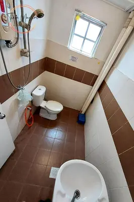 a bathroom with a toilet and a sink at Tiara Homestay 2 with 3 Bedroom, Unlimited Wifi - Brinchang in Brinchang