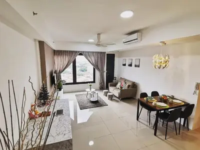 a living room with a couch and a table at Tropicana 218 Macalister at Georgetown 2Carparks in George Town