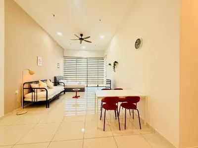 a living room with a table and chairs and a couch at New Georgetown Stylist 2BR Homestay for 10pax \u65e0\u654c\u7f8e\u666f\u4e24\u623f\u6c11\u5bbf Beacon Executive Suite in George Town