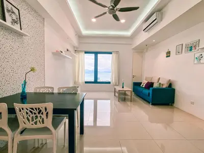 a living room with a dining table and a couch at Dual Key 3BR at Macalister 218 Georgetown 32 WL in George Town