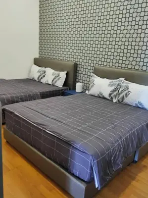 two beds sitting next to each other in a room at Dual Key 3BR at Macalister 218 Georgetown 32 WL in George Town