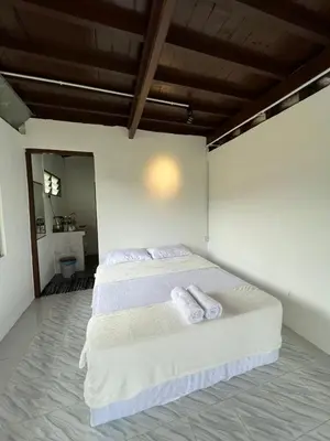 a bedroom with two beds with towels on them at BUKIT LIMAU REST HOUSE in Taiping