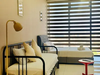 a hospital room with two beds and a window at N New Georgetown Instagramable 2BR Homestay for 10pax \u65e0\u654c\u7f8e\u666f\u4e24\u623f\u6c11\u5bbf Beacon Executive Suite in George Town
