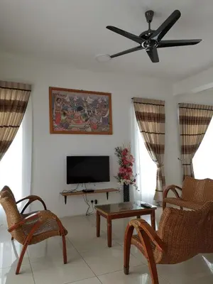 a living room with a ceiling fan and a television at HOMESTAY CAMERON HIGHLANDS GOLDEN HILL 5BR SEMI D GOLDEN HILLS NIGHT Market NO BBQ in Brinchang