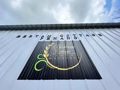 a sign on the side of a building at Bertam Cottage Penang in Kepala Batas