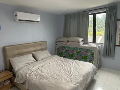 a small bedroom with a bed and a window at Pangkor Coralbay Resort Room 208 apartment in Pangkor