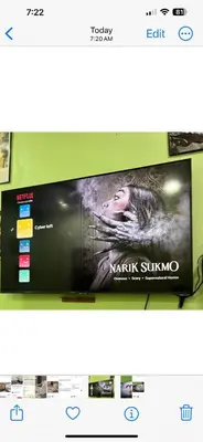 a television screen with a picture of a woman at Cyber Loft Homestay in Ipoh