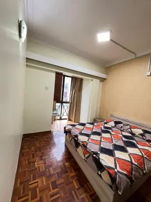 a bedroom with a bed in the middle of a room at Azzalea 3-Bedroom Apartment Cameron Highlands in Tanah Rata