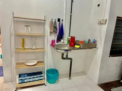 a small bathroom with a sink and a shelf at Entire Cozy Home 16 • 3 bedroom @ Alma Bukit Mertajam in Bukit Mertajam