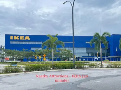 a kera building with palm trees in front of a street at Entire Cozy Home 16 • 3 bedroom @ Alma Bukit Mertajam in Bukit Mertajam