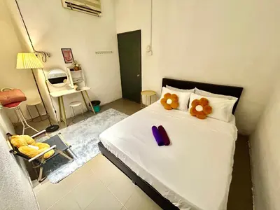 a bedroom with a bed with two teddy bears on it at Entire 33 Cozy House • 3 Bedroom @ Alma Bukit Mertajam in Bukit Mertajam