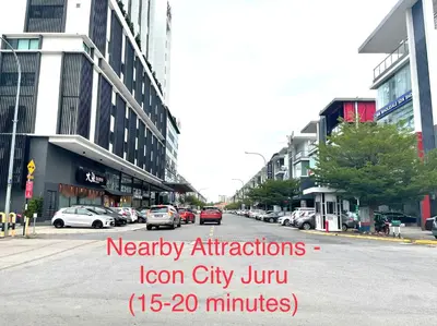 a city street with cars parked on the street at Entire 33 Cozy House • 3 Bedroom @ Alma Bukit Mertajam in Bukit Mertajam