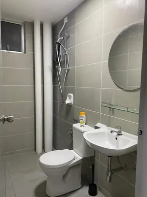 a bathroom with a toilet and a sink at Ammar SkyHome Ipoh in Ipoh