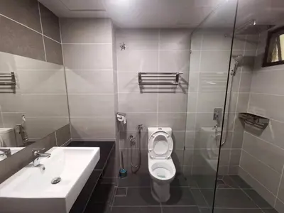 a bathroom with a sink and a toilet and a shower at Cozy Home Copthorne Equatorial Hill Resort in Brinchang