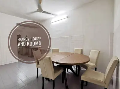 a dining room with a table and a mirror at Chill and Traditional House in Bercham Ipoh in Ipoh