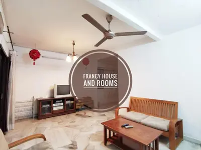 a living room with a mirror and a couch at Chill and Traditional House in Bercham Ipoh in Ipoh