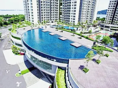 a building with a swimming pool in front of some buildings at ●T11●2Pax●Studio●5min●Queensbay●Pg Bridge View● in Bayan Lepas