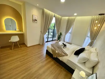 a bedroom with a large bed and a large window at The Cove Premium Suites 7-13pax by IWH Suites in Ipoh
