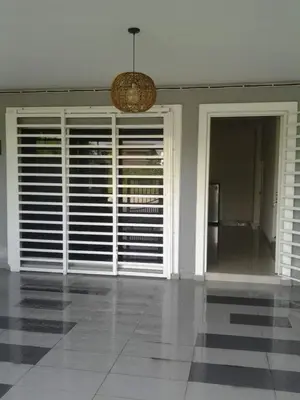 a room with large windows and a chandelier at KS Lavender Kuala Kangsar in Kuala Kangsar