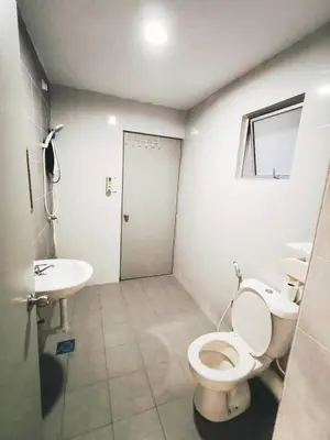 a bathroom with a toilet and a sink at The Venus Sri Manjung Block B High Floor in Seri Manjung