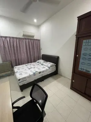 a room with a bed and a chair in it at Homestay Bidor DMaju in Bidur