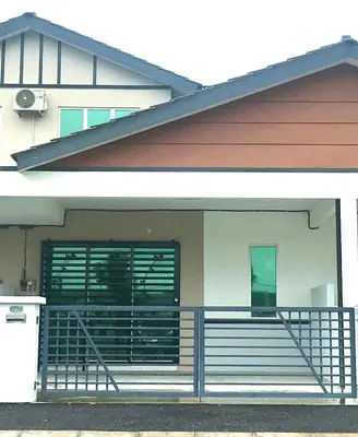 a house with a porch and a balcony with a gate at Chempaka Homestay (Near to UTP UiTM Seri Iskandar) in Seri Iskandar