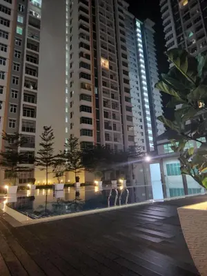 a group of people standing in front of a tall building at SCANDI HOMESTAY IPOH muslem in Ipoh